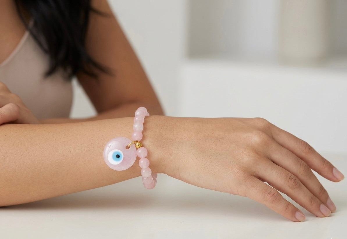 Pulsera de cuarzo rosado con dije ojo turco rosado